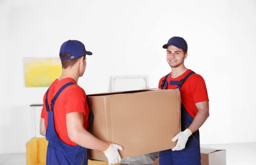 Packed moving boxes and furniture prepared for a flat move in Ruislip