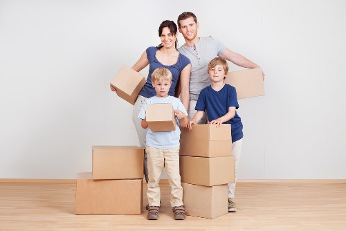Professional movers packing and loading boxes for a home move in Ruislip