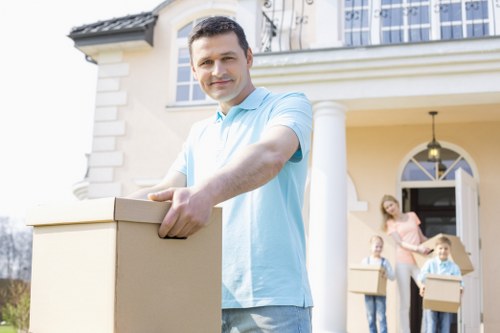 Van and moving staff using protective measures during a house move